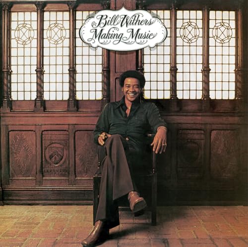 Bill Withers album cover: portrait of a smiling man in a chair.