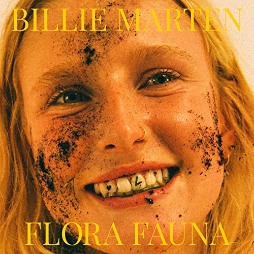 Close-up portrait of Billie Marten with dirt and gold text overlay.