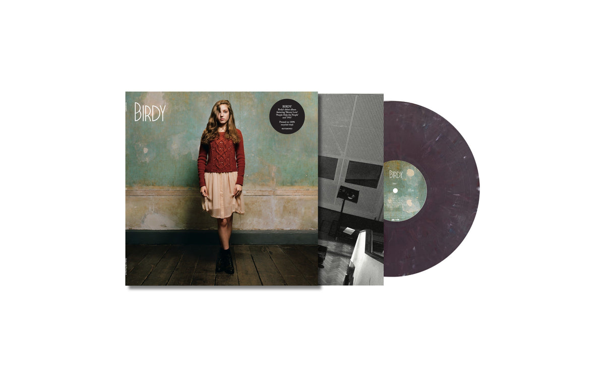 Birdy album cover and purple vinyl record displayed against a white background.