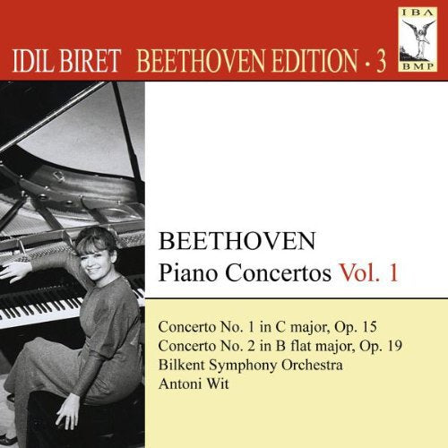 "CD cover with red, white, and yellow sections, featuring a pianist."