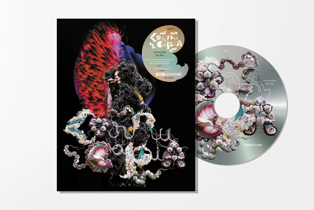 Björk’s “Cornucopia Live” Blu-ray case and disc with abstract, colorful imagery.