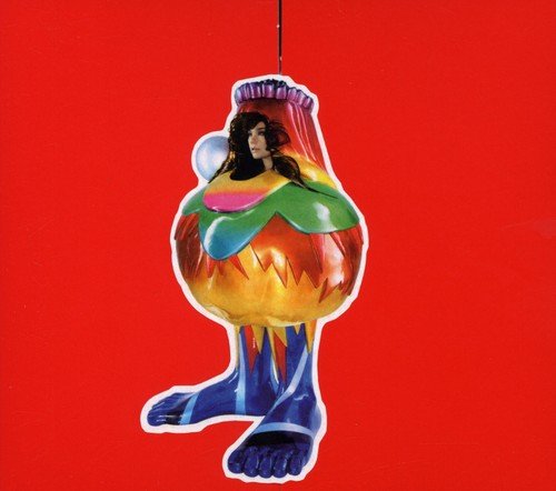 Björk album cover: a person inside a colorful, oddly shaped vessel.