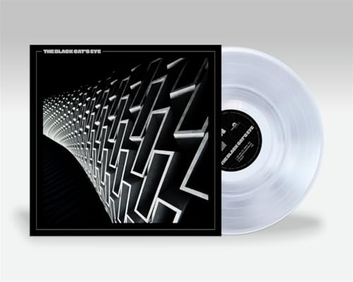Vinyl record with black and white geometric album cover art.