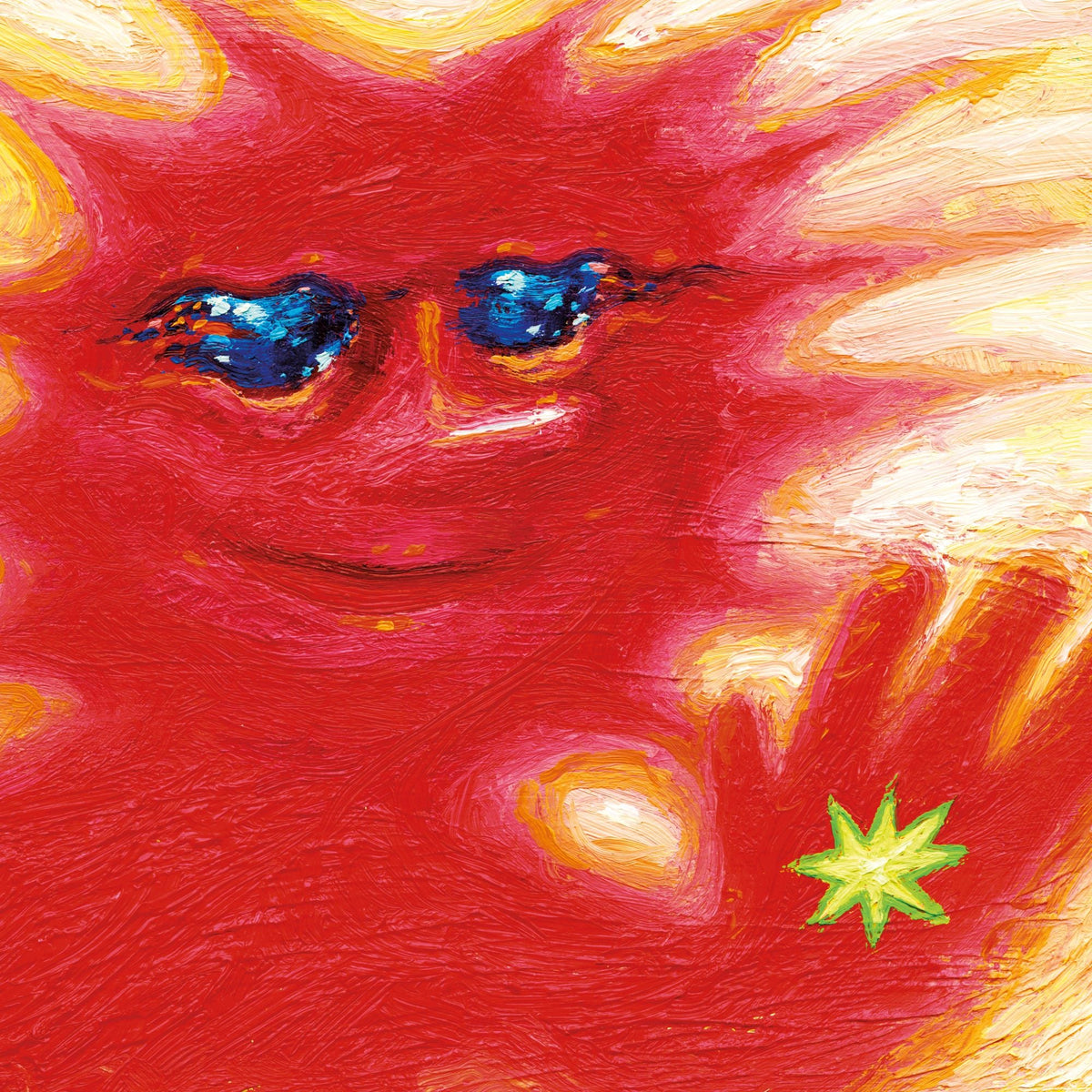 Red, textured face painting with blue eyes and a yellow star.