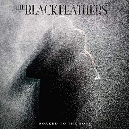 Dark figure obscured by falling water, album cover for The Black Feathers.