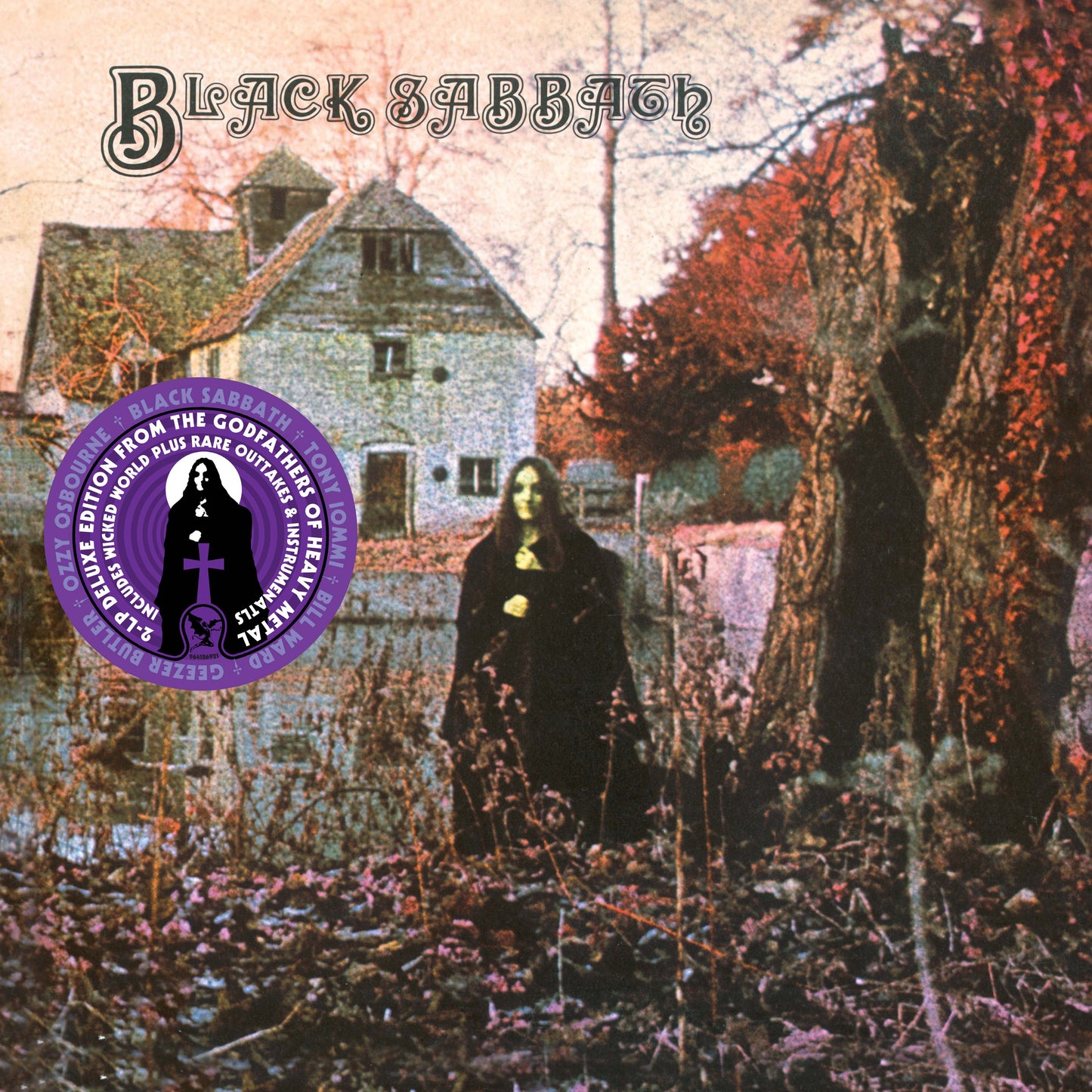 Vinyl cover showing a woman in a black cloak standing before a rural house.