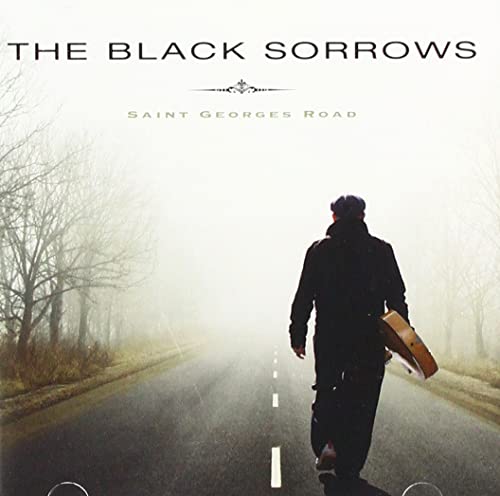 CD cover: man with guitar walking down a foggy road.