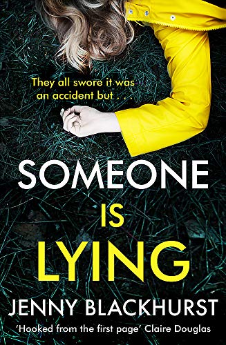 A person in a yellow raincoat lies face down on dark grass.