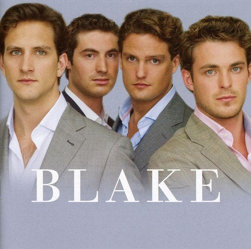 Four men in suits pose against a light blue background with the word BLAKE.