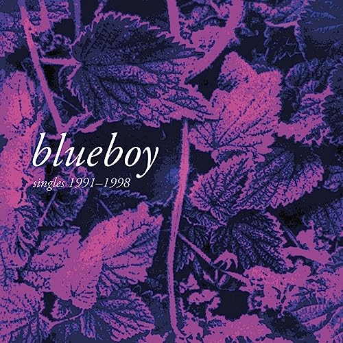 Album cover art with purple and dark blue foliage and white text reading blueboy singles.