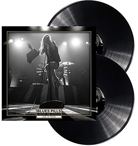 Two black vinyl records with a black and white concert photo cover.
