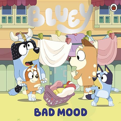 Bluey and Bingo, cartoon dogs, with laundry on a line.