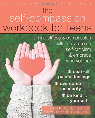 Book cover showing hands holding a paper heart over a green grass background.