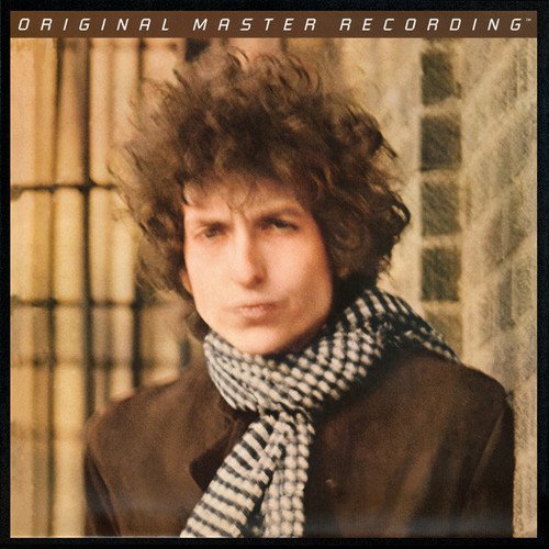 Bob Dylan portrait on album cover, wearing a scarf and jacket.