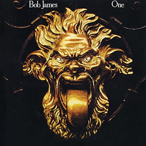 Bob James’ “One” album cover: a golden, ornate face on black background.