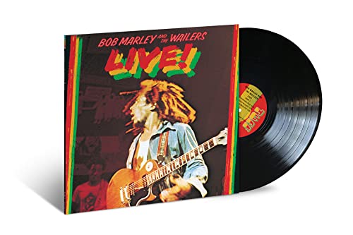 Bob Marley album cover and black vinyl record on white background.