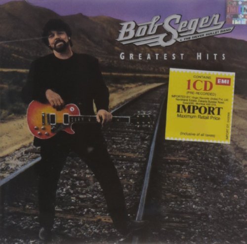 Bob Seger album cover with artist holding a red electric guitar.