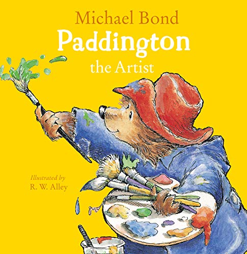 Paddington Bear, in a red hat, painting with brushes and colorful paint.