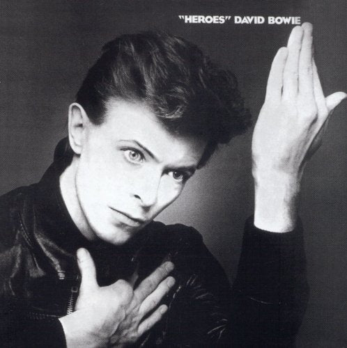 Black and white album cover featuring David Bowie with raised hand.