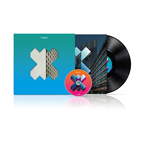 Vinyl record, CD, and album cover with geometric blue and white designs.