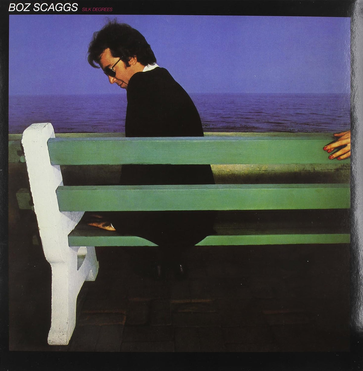 Album cover: Boz Scaggs sits on a bench overlooking the ocean.
