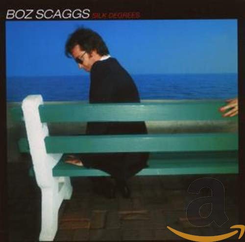 Boz Scaggs album cover: man in suit sits on a bench by the sea.