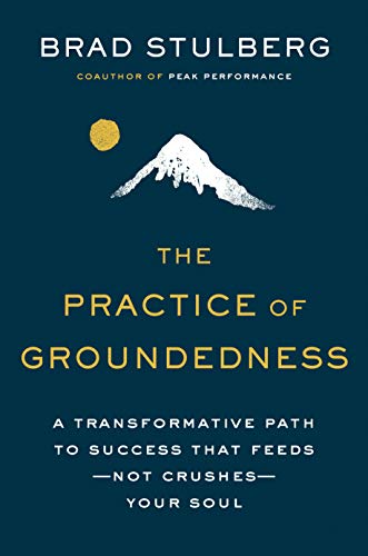 Book cover with dark teal background, white mountain, and gold text.