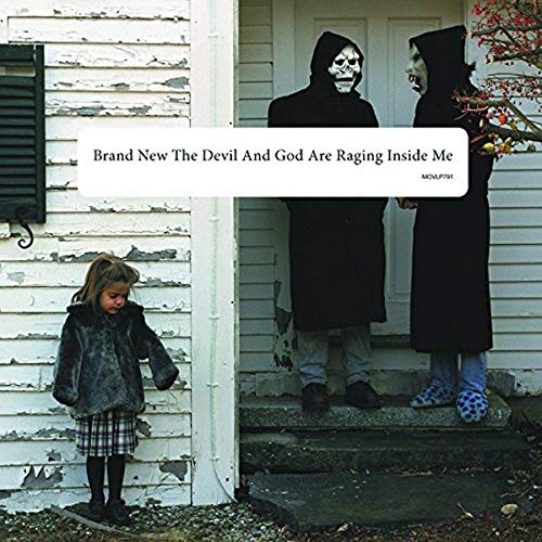 Album cover: child, two hooded figures with masks, weathered house exterior.