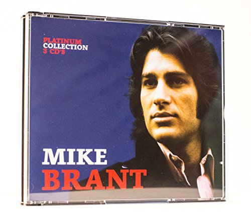 CD case featuring a portrait of singer Mike Brant, with red text.