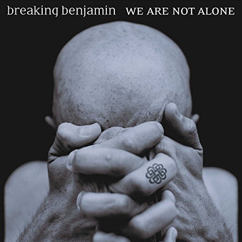 Breaking Benjamin album cover: a head bowed in hands, grayscale.