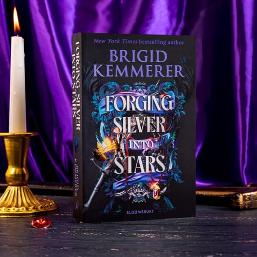 Book cover with silver accents, a candle, and dark, moody background.