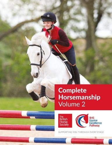 Rider on a white horse jumping a fence, book cover image.