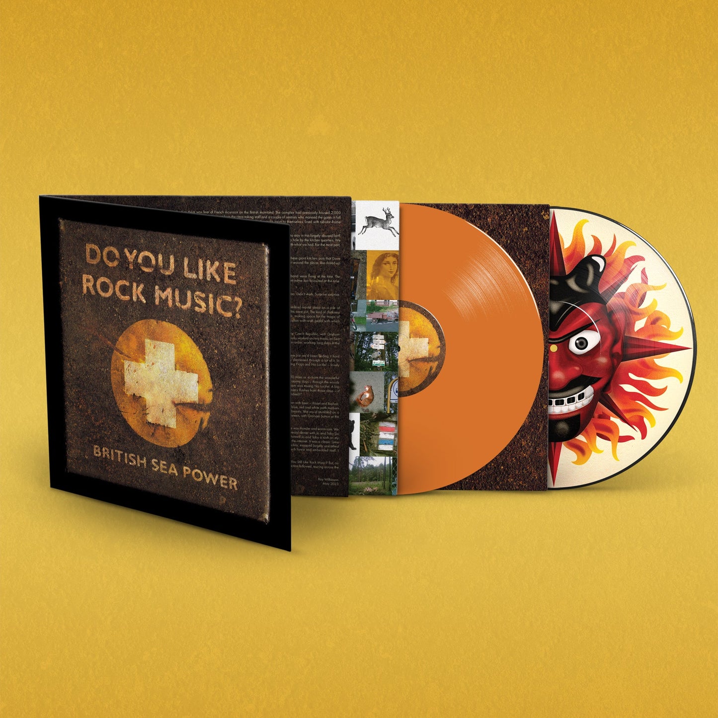 Open gatefold vinyl record album with orange and illustrated discs on yellow background.