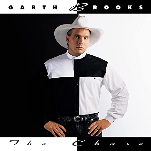 Garth Brooks wearing a white cowboy hat and a black and white shirt.