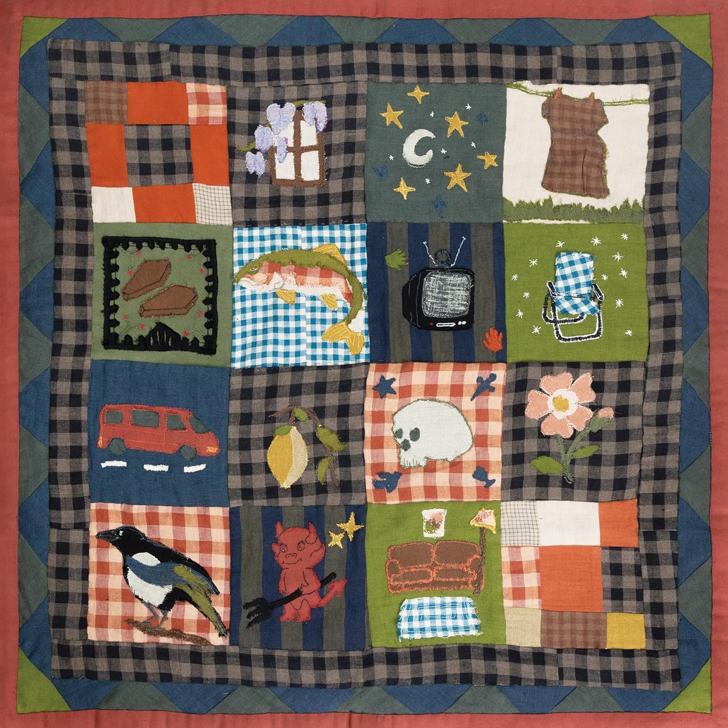 Quilted fabric square featuring a grid of embroidered patches with various folk art motifs.