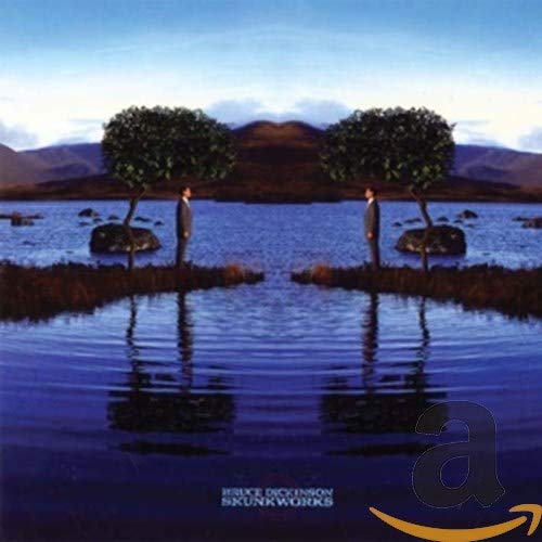 A symmetrical landscape with two men standing by a lake under a blue sky.