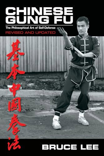 Man in martial arts uniform demonstrating stance with raised hand, Asian text and name.
