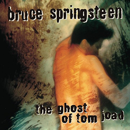 Album cover featuring a blurred silhouette of a person against a textured background.