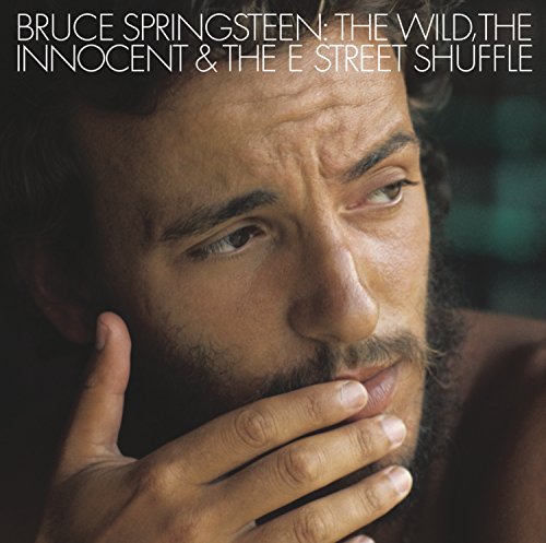 Close-up portrait of Bruce Springsteen on album cover, hand to face.