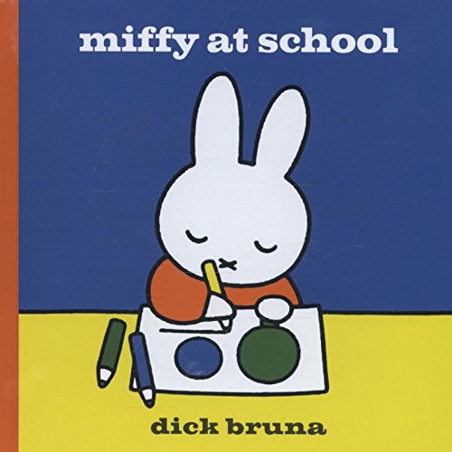Miffy the white rabbit drawing with crayons on a blue and yellow background.