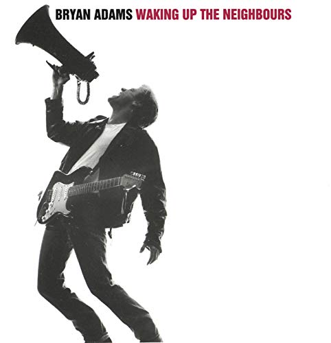 Bryan Adams album cover: musician with guitar and megaphone, black and white.