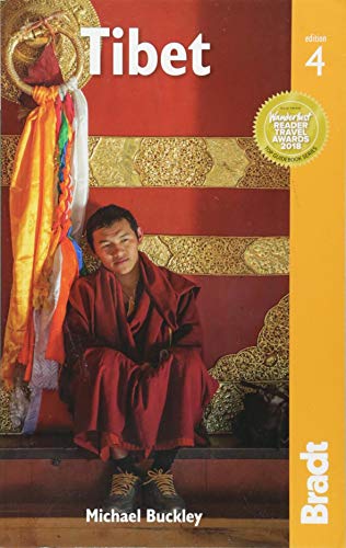 Cover of "Tibet" travel guide featuring a monk in red robes.