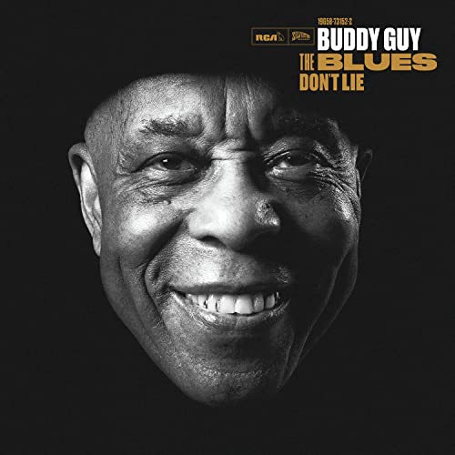 Black and white portrait of Buddy Guy smiling, album cover for "The Blues Don't Lie".