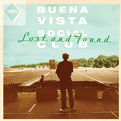 "Album cover with man standing in an empty outdoor amphitheater, vintage style."