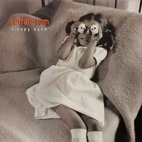 Buffalo Tom’s “Sleepy Eyed” CD cover: girl holding skull figurines.