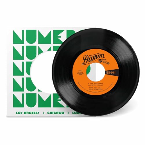 A black vinyl record with an orange label in front of a white sleeve.