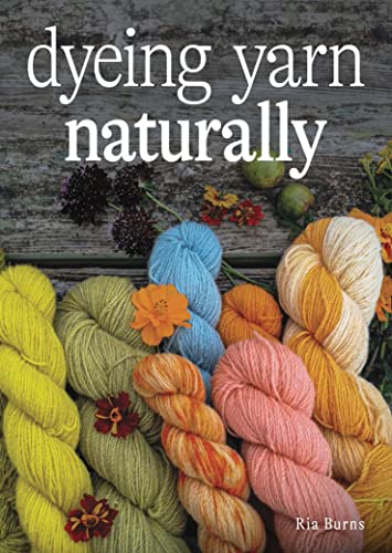 Book cover: colorful dyed yarn with flowers on a wood surface.