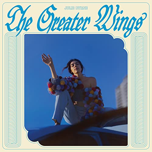 Album cover for Julie Byrne’s “The Greater Wings” featuring a woman in blue.