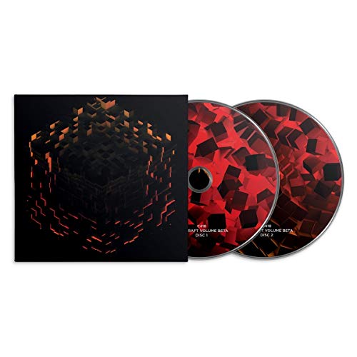 Two red Minecraft Volume Beta CDs with a black cubic case.
