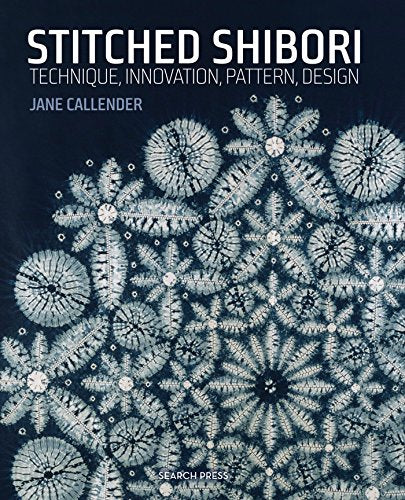 Book cover featuring white floral shibori patterns on a dark blue fabric background.